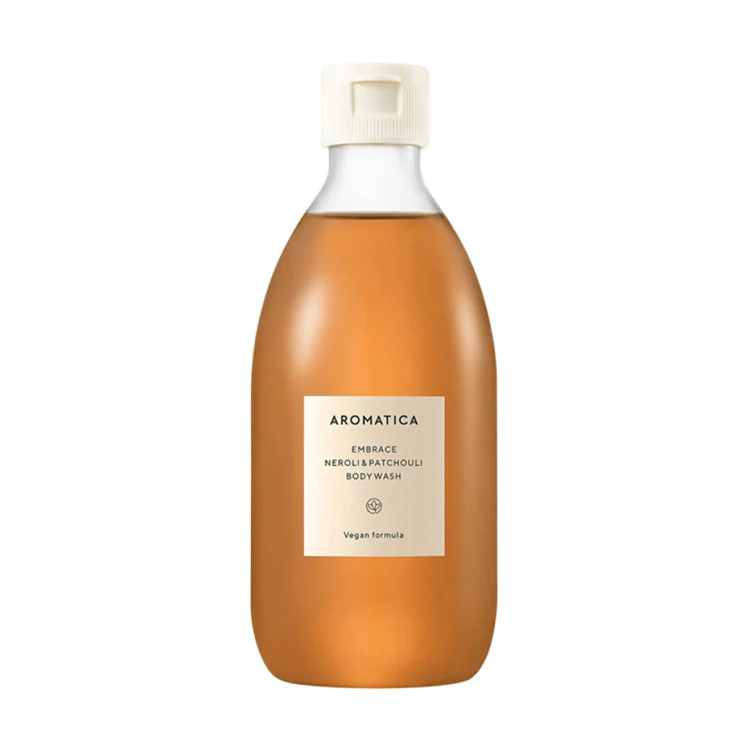 AROMATICAのネロリ＆パチョリ ボディウォッシュの製品画像。琥珀色の液体が入った丸みのあるエコボトルデザイン。