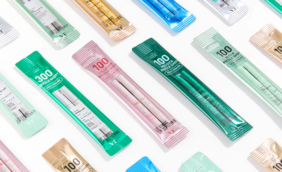 Individual VT COSMETICS Reedle Shot stick packs in different variants, displayed in color-coded packaging for each formula.