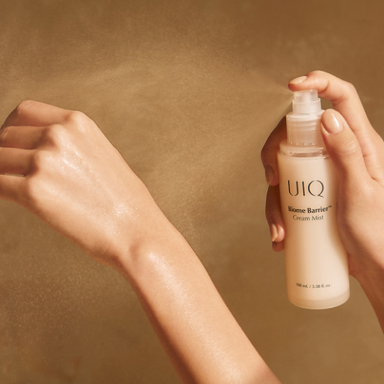 Ultra-fine spray application of UIQ Biome Barrier Cream Mist demonstrating lightweight hydration for a korean glass skin routine