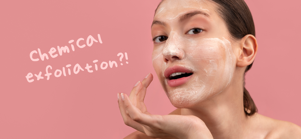 chemical exfoliation concept showing a model applying a gentle exfoliating skincare product to her face, illustrating how chemical exfoliation works without physical scrubbing
