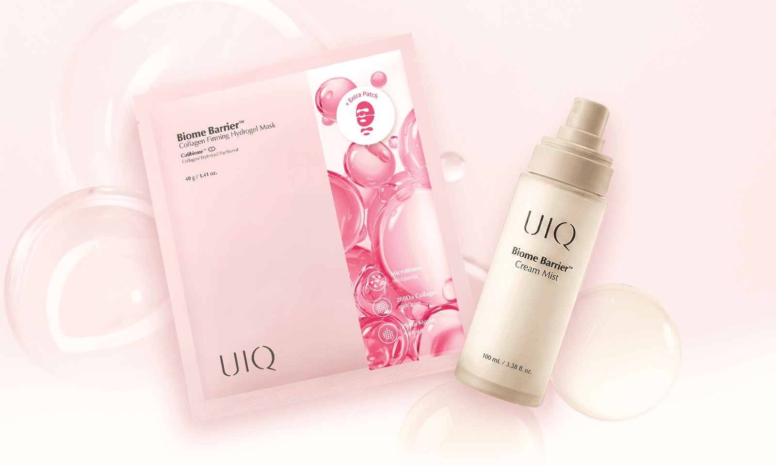 A flat lay of UIQ skincare products on a soft pink background with glossy water bubbles. It features the Biome Barrier Collagen Firming Hydrogel Mask in pink packaging and the Biome Barrier Cream Mist in a sleek cream-colored spray bottle.